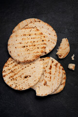 .Pita bread on dark background. Arabic, lebanese bread, traditional food.