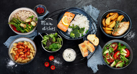 Table of various healthy food dishes. Healthy food assortment. Dieting concept.