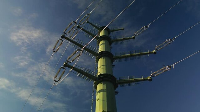 Modern high voltage pylone. Electricity supply and new infrastructure concept. Low angle shot.