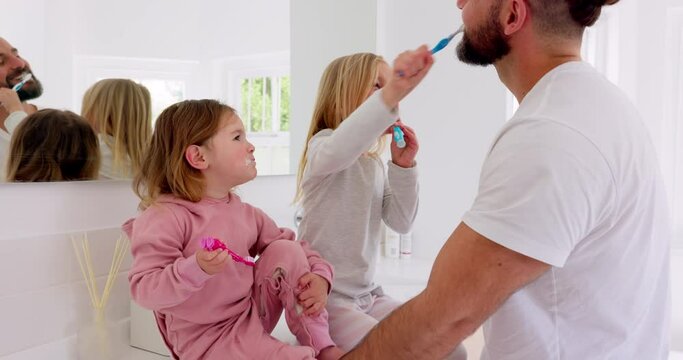 Girls, father and brushing teeth for bonding and being happy for bathroom, playful and laugh together. Growth, child development and dad teach female children oral hygiene, healthcare and dental.