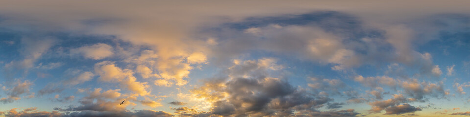 Golden glowing sunset sky panorama with Cirrus clouds. Hdr seamless spherical equirectangular 360...