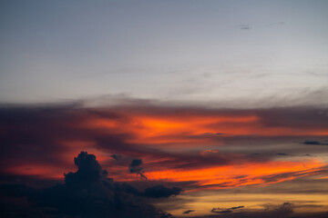 The dramatic colors of the sunset in the sky gradient from blue to orange.