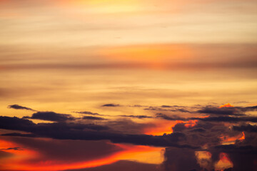 The dramatic colors of the sunset in the sky gradient from blue to orange.