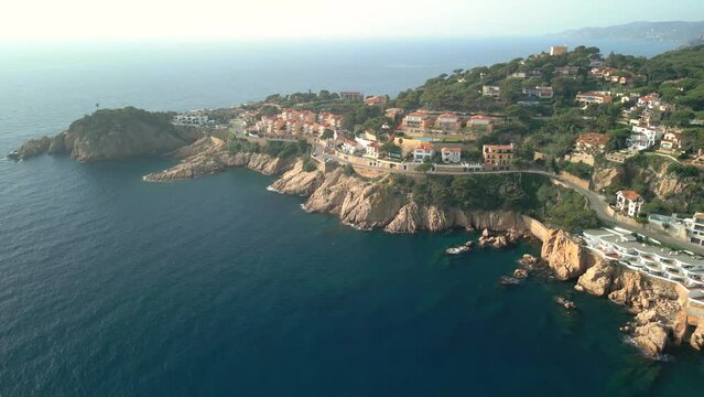 Aerial image of the cliffs of Sant Feliu de Guíxols on the Costa Brava in Girona luxury property high standing houses on the seafront