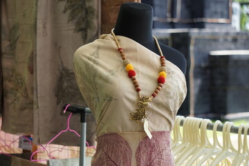 Naklejka premium Beautiful handmade batik fabric and necklace