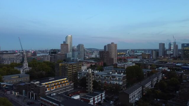 Drone shot flying over Tower Hamlets in East London at sunset, England