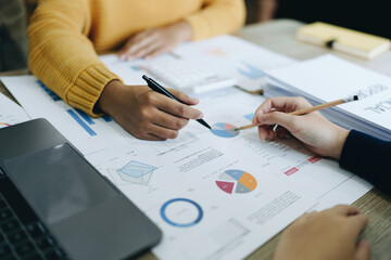 Asian entrepreneurs and business people meeting in a conference room in business planning, financial budget and investment risk assessment to analyze customer groups to increase company growth