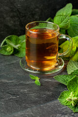 Mint tea on a black table.