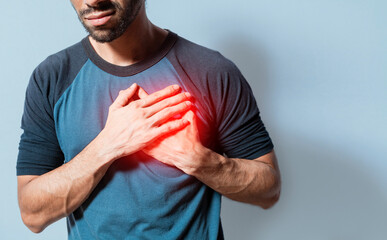 People with chest pain isolated, young man with tachycardia, man with heart pain on isolated background, young man with heart pain. Concept of people with heart problems - obrazy, fototapety, plakaty