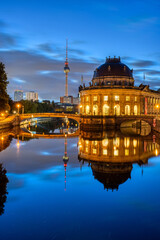 The Bode-Museum and the Television Tower reflected in the river Spree in Berlin at night