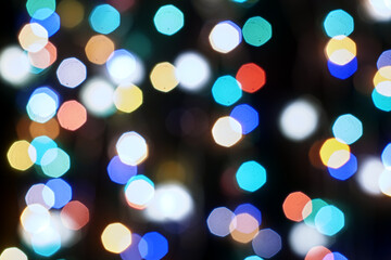 Obraz premium multicolored festive lights on a black background screensaver backdrop