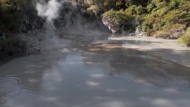 Aerial push-out shot above the boiling mud pools at Waiotapu, Rotorua, New Zealand