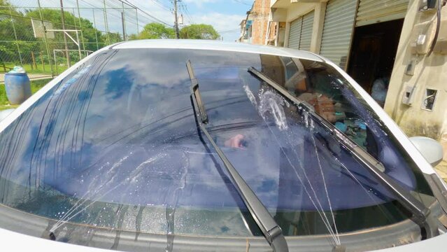 Triggering car windshield wipers and getting water