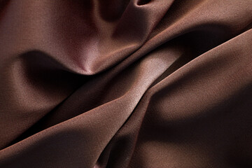 Background from brown silk satin fabric texture 