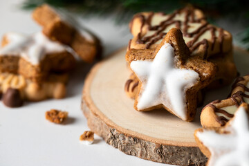 Close up of Star shape ginger cookies with sugar icing Typical Christmas treat