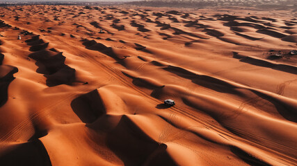 Crossing sand dunes in the desert - obrazy, fototapety, plakaty