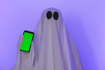 The ghost shows a phone with a green screen. Phone with chromakey. The ghost makes an order from...