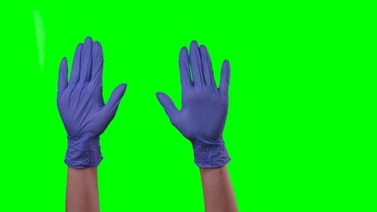 Woman hands in a medical blue gloves showing gesture of welcoming. Doctor arms in protective gloves gesturing hello gesture and waving palms. Close up on green screen background.