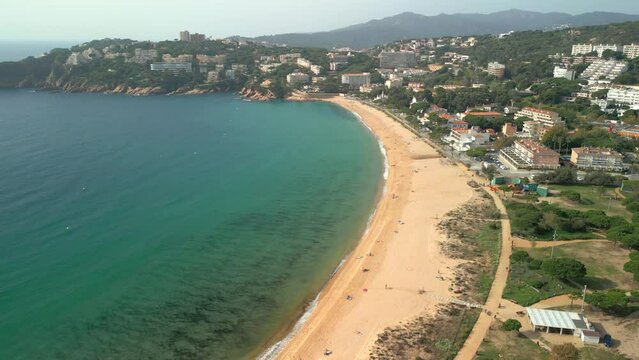Aerial image of the beach of S'Agar&oacute; on the Costa Brava of Spain sea blue duquesa beach without people paseo costanero