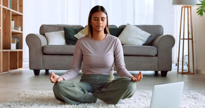 Meditation, relax and woman with a laptop for music, podcast and video on the internet in a living room. Yoga, peace and girl training her mind to be zen, free and calm with audio on a computer