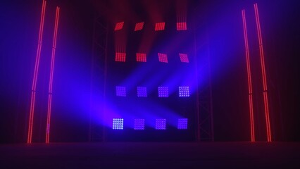 Stage red and blue lights shine on a dark disco. Beams of spotlights and spot lights illuminating an empty smoky stage in nightclub. Lighting equipment. Light effects.