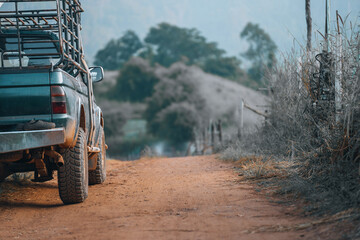 Pickup truck for transportation vegetable parked on the side of the road on mountain in Chiang Mai, Thailand. Vintage Tone and Selective Focus