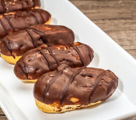 Close-up of Chocolate eclairs on white plate