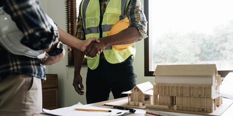 Hand in hand between project contractors and customers due to negotiation of expenses and investments, construction and repair of residential buildings.