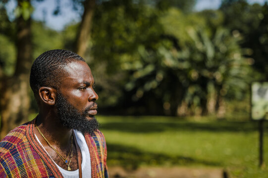 A black man in a garden 