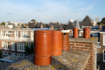 Rooftop view in The Hauge, Netherlands, with chimneys in the foreground