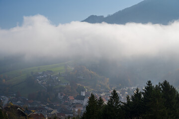 wafts of fog in the mountains of Austria
