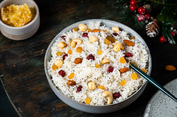 Kutia is a ceremonial grain dish Christmas sweet meal. Boiled rice porridge. traditional Slavic holiday ritual dish. Sweet pilaf with nuts. Kutya Ukrainian. Orthodox christmas