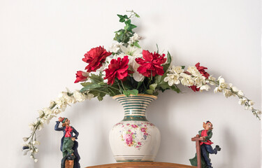vintage decoration with roses and other flowers on vase