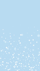 Snowfall overlay christmas background. Subtle flying snow flakes and stars on light blue winter backdrop. Festive snowfall overlay. Vertical vector illustration.