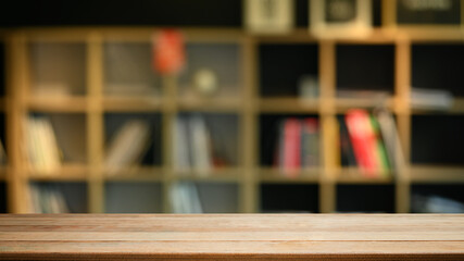 Empty wooden against blurred bookshelf background. Copy space for your product display or design montage