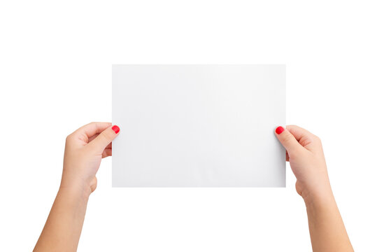Girl's hands hold a blank paper in a horizontal position. Isolated background in white. Clean paper for copy presentation