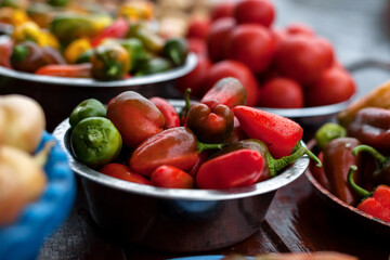 Sweet pepper, hot chili pepper. A vegetable counter at a street market.