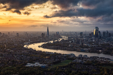 High panoramic view of the urban London skyline during a autumn sunset with clouds and moody light  - Powered by Adobe