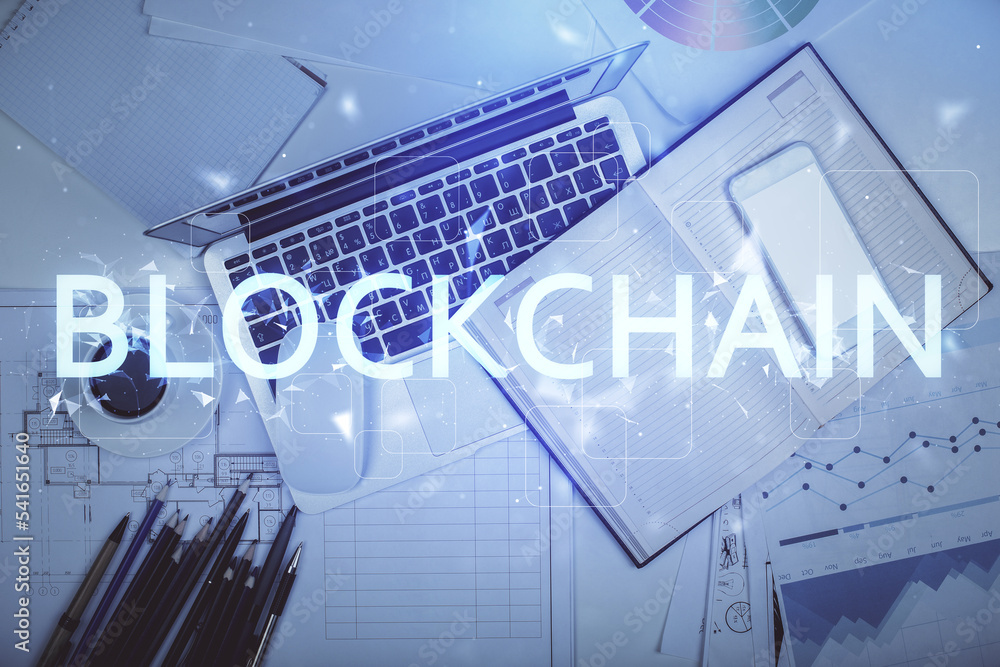 Poster blockchain theme hologram drawings over computer on the desktop background. top view. multi exposure