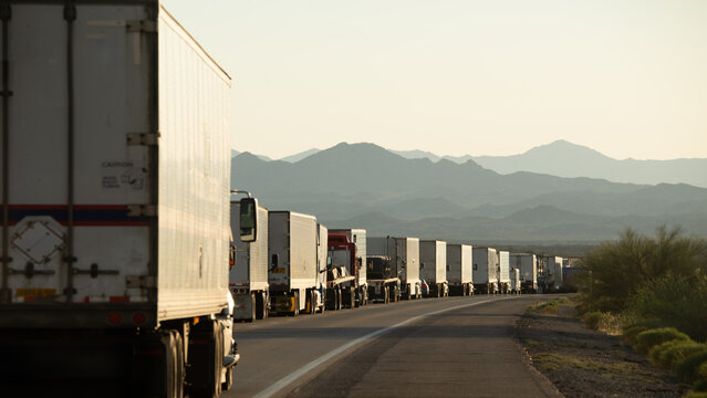 A row of trucks bumper to bumper on a road, San Bernardino, California, USA