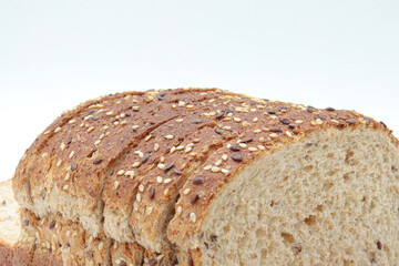 Close-up sliced ​​wholemeal bread, on white background
