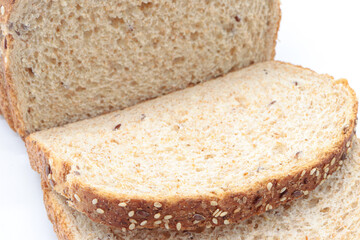 Close-up sliced ​​wholemeal bread, on white background
