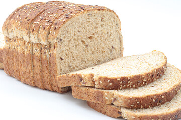 sliced ​​wholemeal bread, on white background. Concept of healthy food, balanced breakfasts, fiber foods.