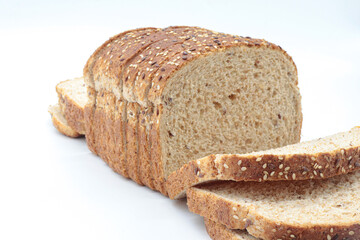 sliced ​​wholemeal bread, on white background. Concept of healthy food, balanced breakfasts, fiber foods.