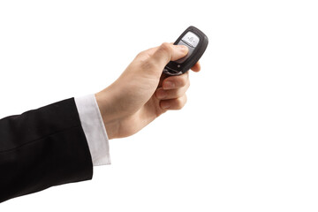 Male hand in a suit pressing a car key