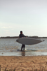 Windsurfer enjoying sunny weekend on the lake.