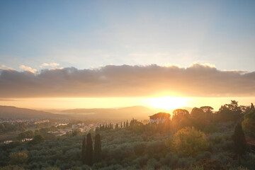Backlighting cityscape of Florence at dawn