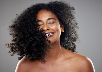 Black woman, hair and beauty, hair care or curly hair on gray studio background. Smile, skincare...