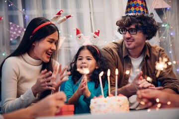 Happy family celebrating birthday together at home
