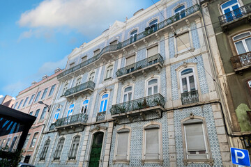 Fototapeta na wymiar Typical architecture of the capital Lisbon city streets and people.